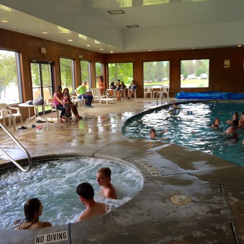 A group of people enjoying themselves in a hot tub at a campground in western New York.